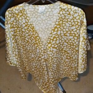 A gold and white blouse